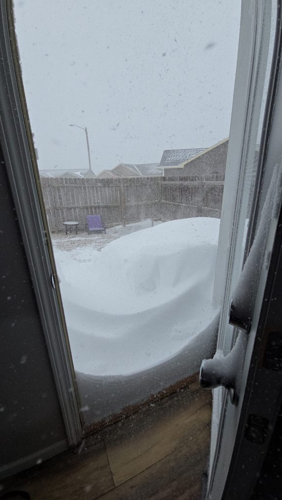 Heavy snow blocking patio door view